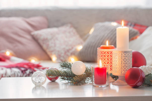 istock Christmas decora with candles and balls on white table indoor 1193911082