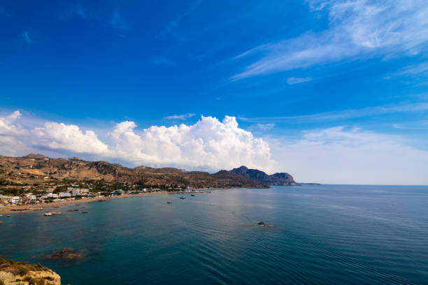 Rhodes island, Greece. Aerial panorama Stegna beach and village with white idyllic clounds