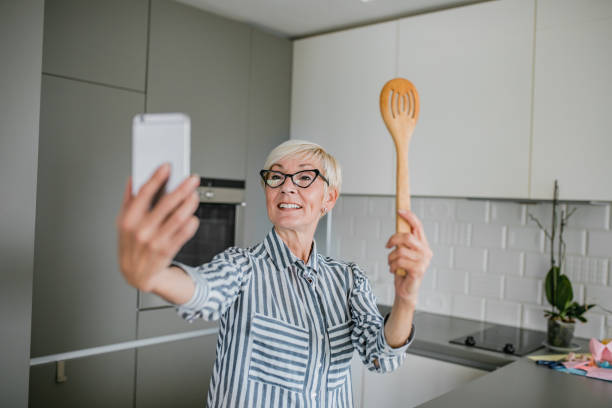istock Senior woman vlogging 1193912902