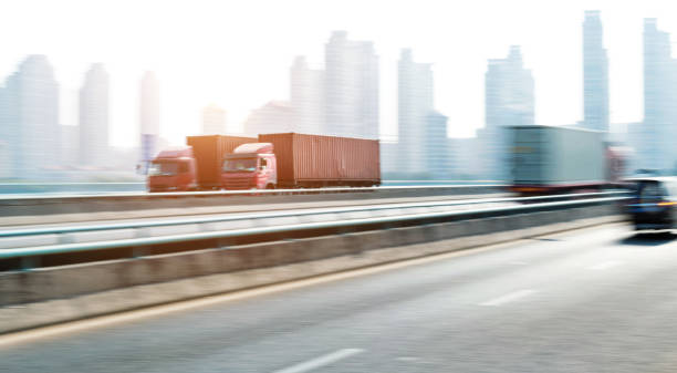 istock Trucks speeding on city viaduct 1193913523