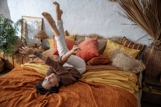 istock Smiling pretty lady is holding hands up at home 1193913808