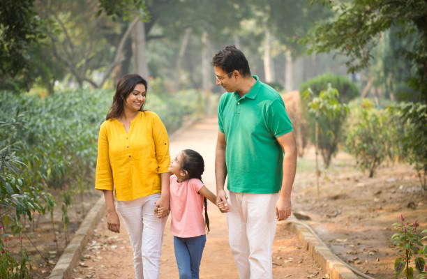 istock Happy family at park 1193915721