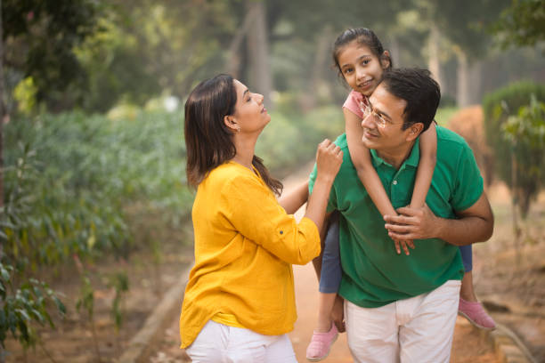 istock Happy family at park 1193916113