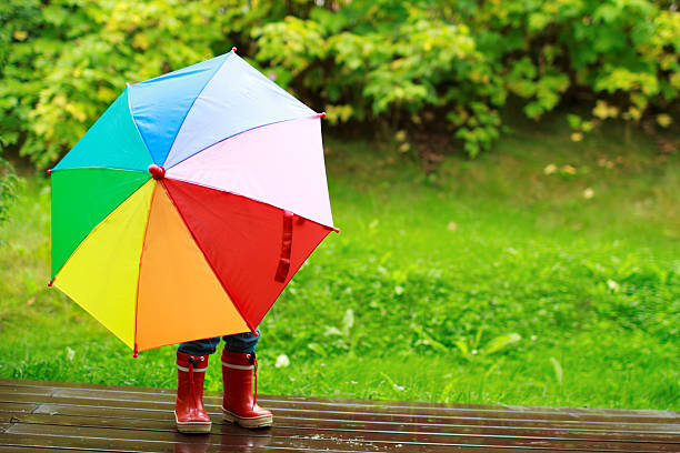 istock Little girl hiding behind umbrella 119391702