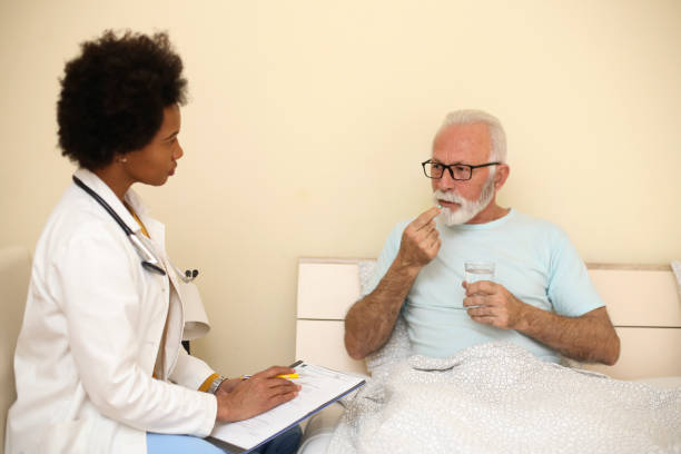 istock Doctor with an ill patient 1193922595