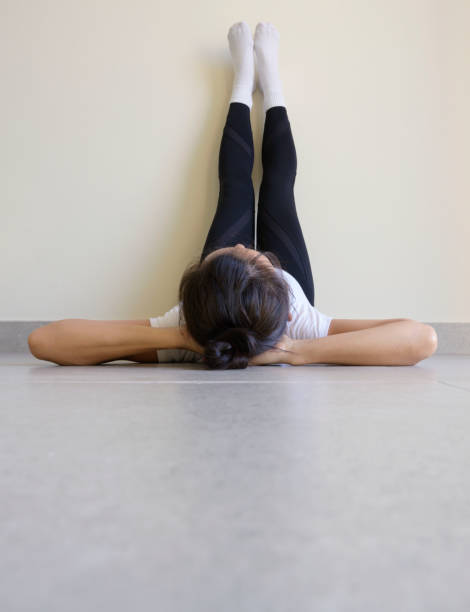 istock Yoga woman lying on floor 1193922610