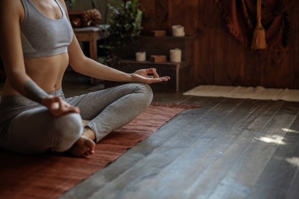 istock Slender peaceful lady practicing yoga at home 1193923809
