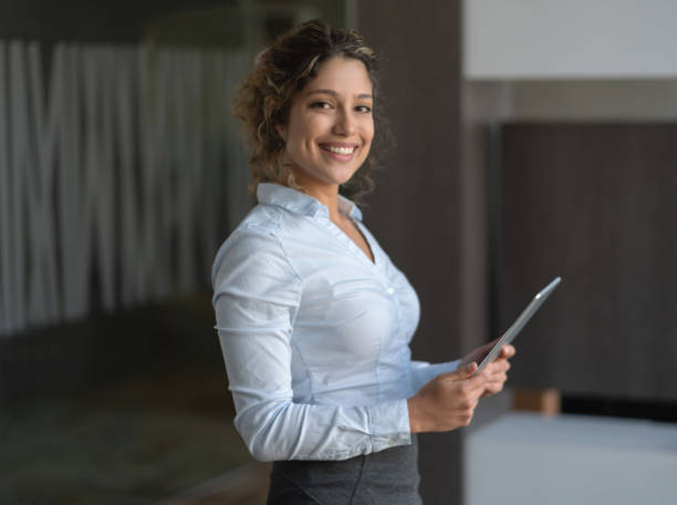 istock Business woman working on a tablet computer at the office 1193924021