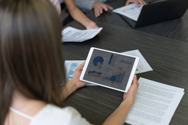 istock Close-up on a tablet computer showing a growth graphs at the office 1193924025