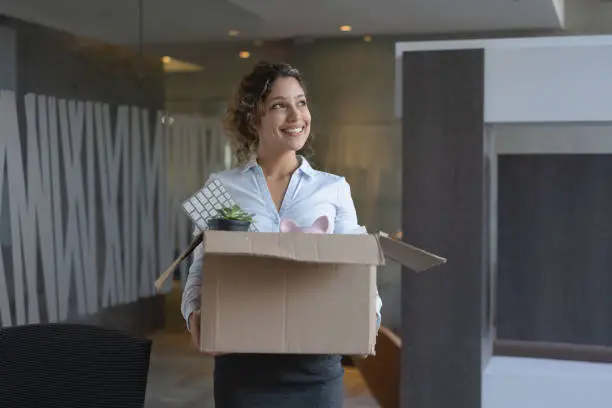 Photo of Business woman moving into a new office