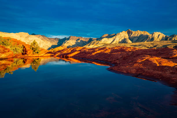 Reflections of Sunrise in Snow Canyon State Park Petrified Sand Dunes, Snow Canyon State Park, Utah, USA snow canyon state park stock pictures, royalty-free photos & images