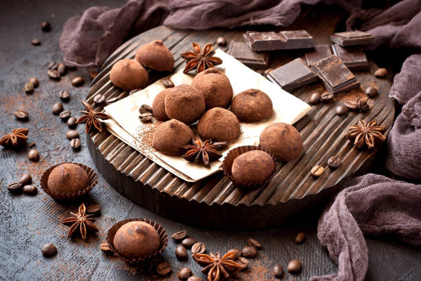 istock Chocolates Truffles  and pieces chocolate  on  dark background 1193930724