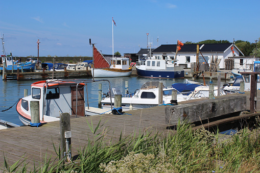 Tars, Denmark, 18 July 2019: The tiny and picturesque Tars fishing marina and harbour, on the island of Lolland in Denmark. A pretty travel destination 'off the beaten track'.