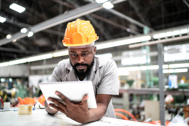 istock Man working with his digital tablet in the factory 1193934788