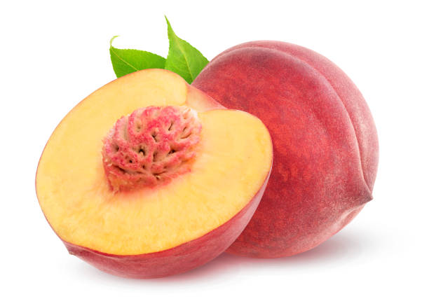 Isolated cut peaches Isolated peaches. One whole peach fruit and a half with kernel isolated on white background with clipping path peach photos stock pictures, royalty-free photos & images