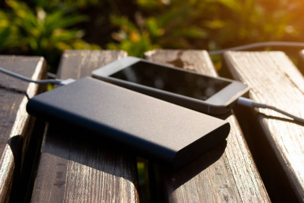 istock power bank charges the phone on the bench 1193939266