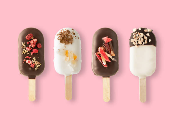 istock Different variants of cake popsice creams on pink background 1193942021