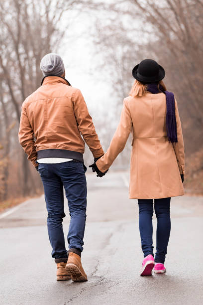istock Couple enjoying outdoors in cold autumn / winter time. 1193950372
