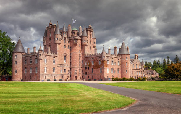 The Castle of Glamis is the typical Scottish castle, stately, full of turrets and battlements, was the legendary stage of Shakespeare's Macbeth. stock photo