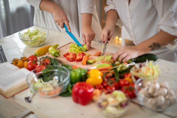 istock Female hands making healthy dinner. 1193951146