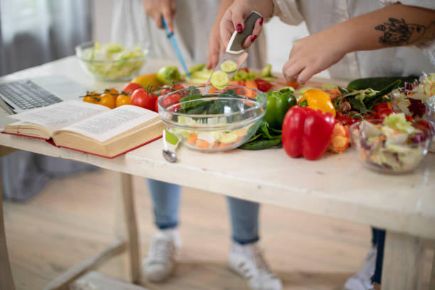 istock Female hands making healthy dinner. 1193951158