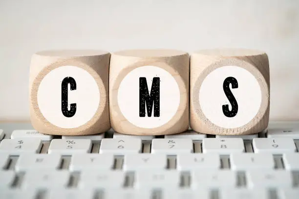 acronym CMS on cubes on a computer keyboard