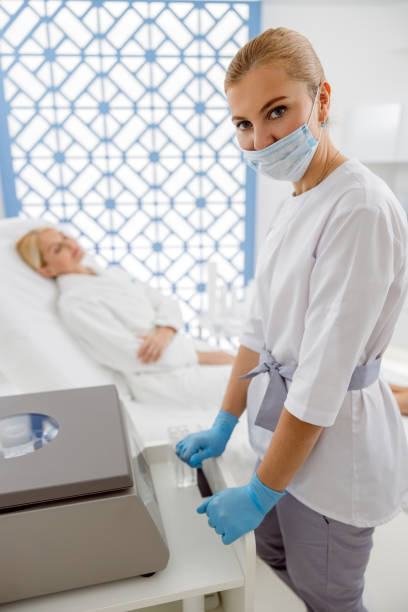istock Masked beautician standing and looking at camera 1193951391