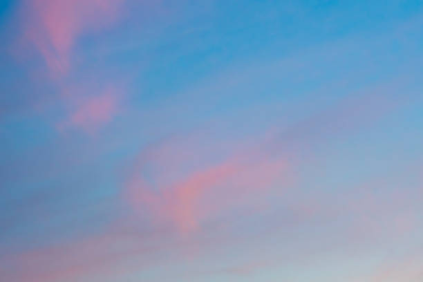 istock Pink sunset clouds and blue sky 1193952911