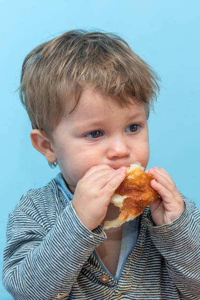 istock A one-year-old boy eats Traditional Serbian cheese pie gibanica alone 1193954353
