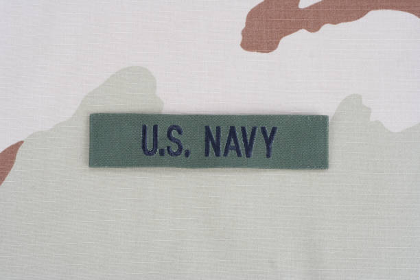 istock US NAVY branch tape on desert camouflage uniform 1193956217