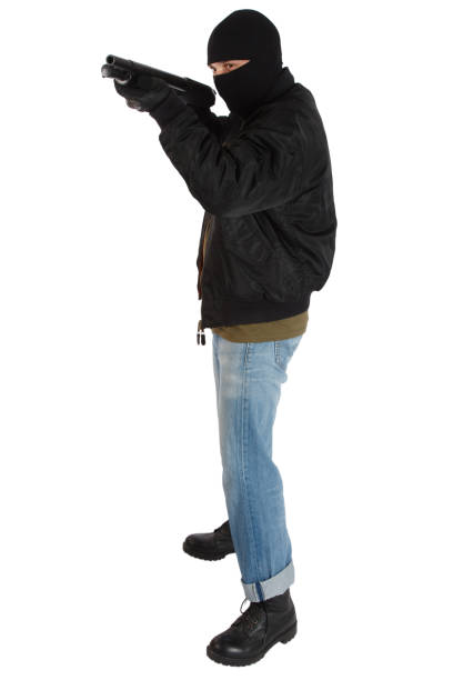 грабитель в черной маске с дробовиком - armed forces human hand rifle bullet стоковые фото и изображения