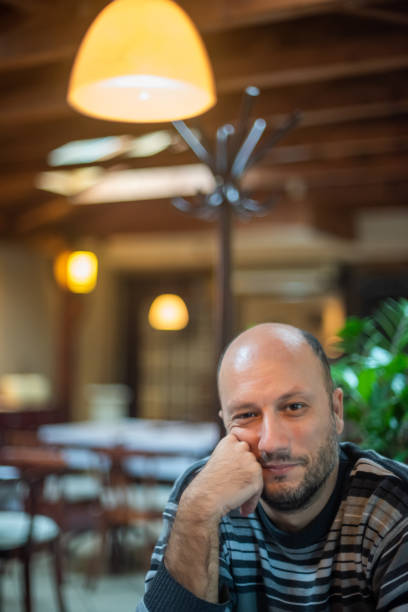 istock A man sits alone in a restaurant 1193956386