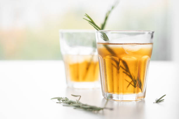 istock two glasses with lemonade and rosemary on a light background in high key 1193959389