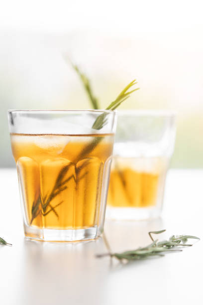 istock alcoholic drink with lemon and rosemary on a white background 1193959472