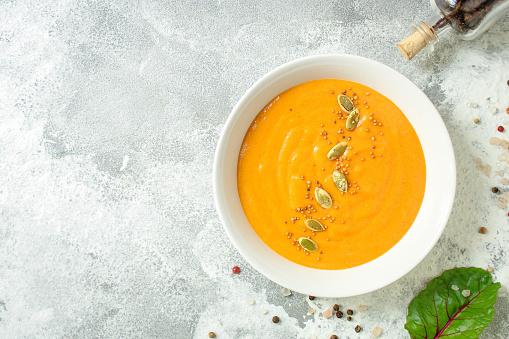 pumpkin or carrot soup (first course, delicious vegetable vitamin food) menu concept