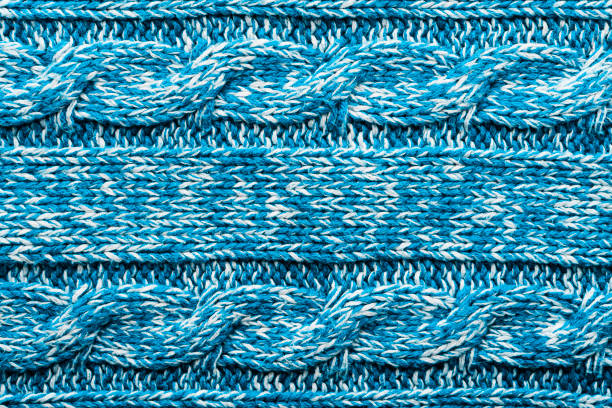 istock The texture of a knitted blue white sweater. 1193959768