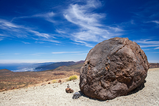 Tenerife, view from hiking path to the summit towards dark lava bombs called Huevos del Teide, Eggs of Teide