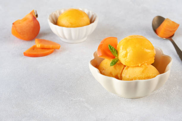 istock Persimmon ice cream sorbet. Close up with copy space 1193967779