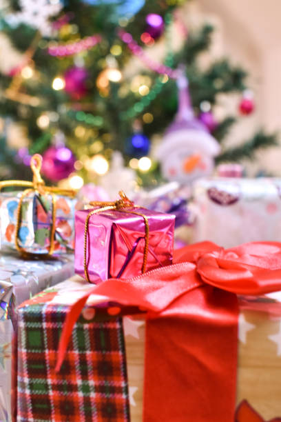 istock Bunch of presents in front of a Christmas tree 1193969450