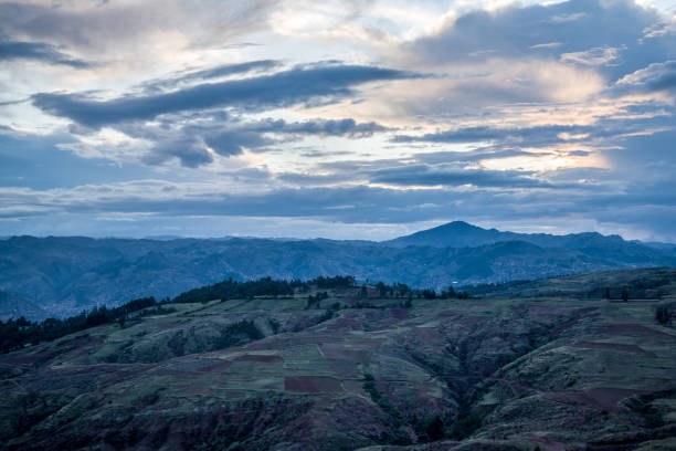 istock mountains near trees and cloudy sky 1193973242
