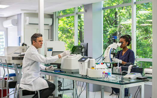 Pathologist Definition Pathologist Processing Samples And Tech Using Microscope Stock Photo ...