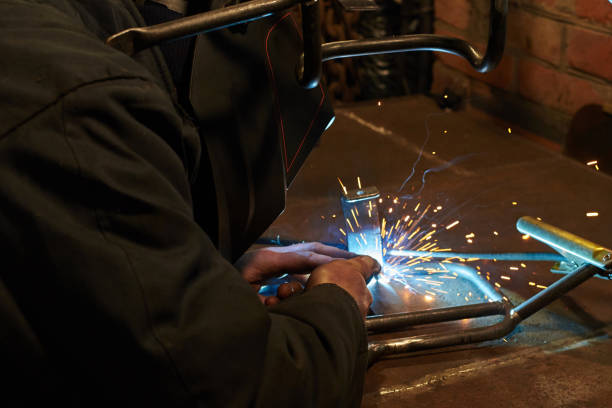 istock A man in a protective mask carries out welding work. 1193983575