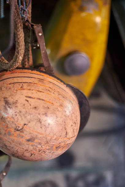 istock An old vintage scratched helmet hangs in a garage. 1193983694