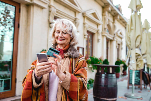 istock Senior woman using phone 1193986865