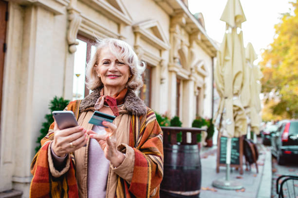istock Senior woman using phone 1193986878