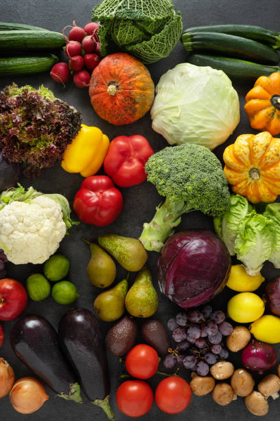 istock Assortment of fresh vegetables on dark background 1193988520
