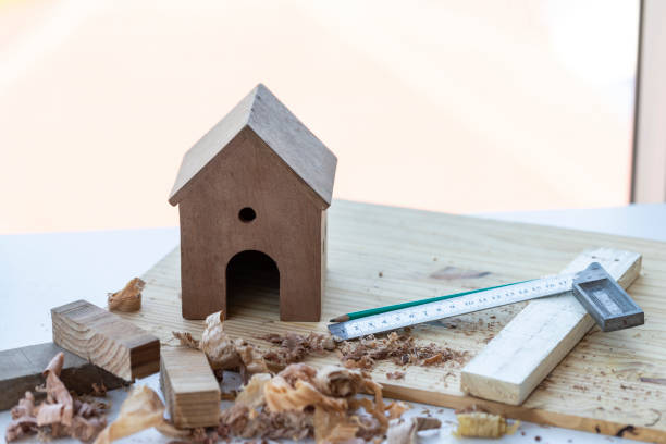 istock Construction and home renovation concept, model house and work tools on the table. 1193988557