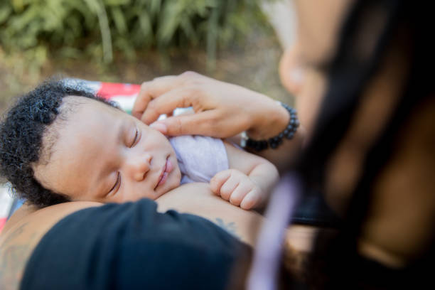 istock Mother holding sleeping infant boy 1193990409