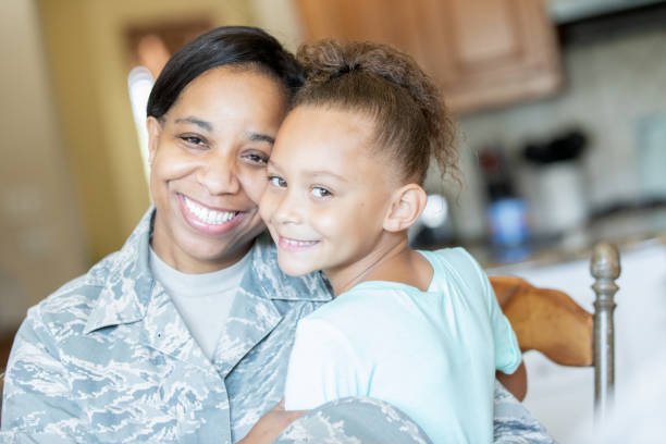 istock Veteran mom smiling with young daughter 1193990484