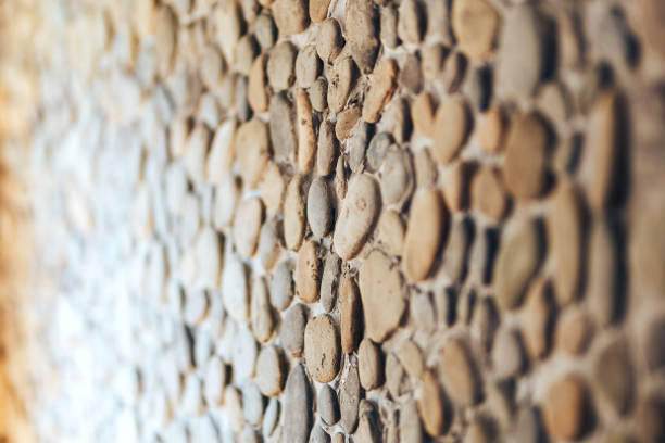 Background texture of different round stone wall